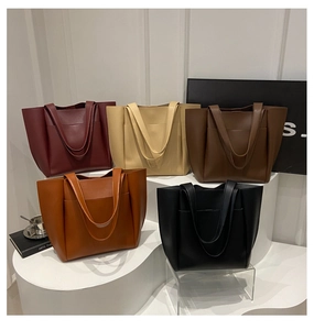 Five minimalist large-capacity leather tote bags displayed in multiple earthy colors