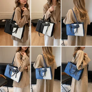 Vista multi-ángulo de bolsos tote grandes bicolor con cremallera y correas largas