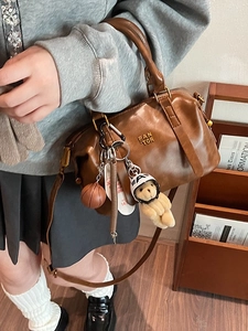 Vintage brown baseball bag with PAN 'TOR logo and cute charms on adjustable strap