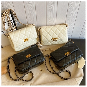 Quilted leather chain bags in black and cream white with gold hardware detail