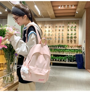 Pink minimalist backpack featuring KEKEM lettering and cute cloud plush charm detail