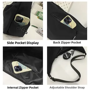 Detail view of durable black nylon crossbody bag with side pockets and round charm pouch