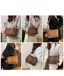 Fashionable leopard print bucket bag detail with plush bear charm and striped scarf accent