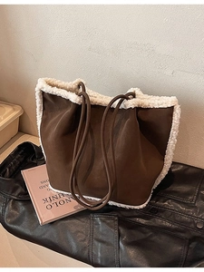 Brown faux suede tote bag with white faux fur trim and dual leather shoulder straps