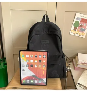 Detail of waterproof nylon backpack showing large front pocket and tablet compatibility