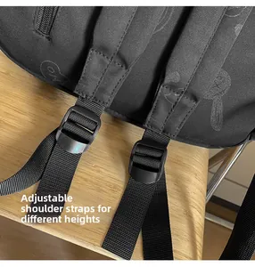 Detail of adjustable black nylon shoulder straps with cartoon pattern for comfort