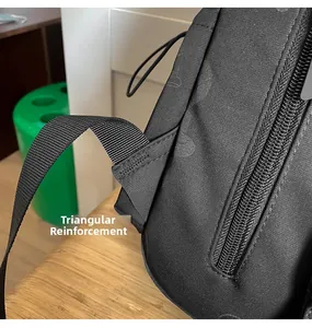 Detail of triangular reinforcement stitching on durable black nylon backpack strap