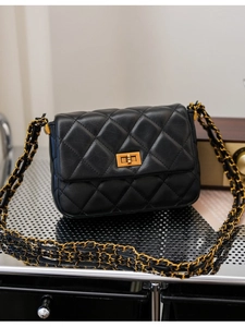 Quilted black chain shoulder bag with classic diamond pattern and gold-tone turn-lock