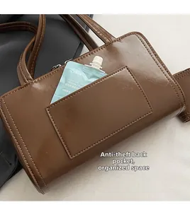 Brown glossy shoulder bag with a functional hidden anti-theft back pocket for storage