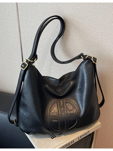 Versatile black soft PU leather tote bag with round logo and golden hardware accessories
