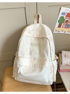 Cute cream backpack with pink rabbit prints and large capacity for students and daily casual use