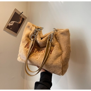 Detailed view of plush khaki tote bag featuring soft faux fur and brown MEAFOY embroidery