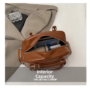Internal capacity of brown leather tote bag showing tablet and power bank storage