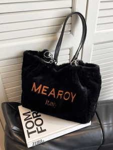 Fashionable black faux fur tote bag with orange embroidery and leather straps for winter