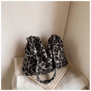 Close-up of soft leopard print faux fur texture on a plush winter tote bag