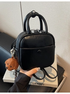 Retro black mini square bag with silver hardware and a cute teddy bear plush charm