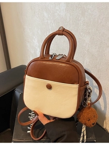 Retro two-tone PU leather crossbody bag in brown and beige with a teddy bear charm