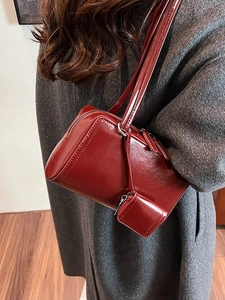 Deep red vintage rectangle shoulder bag in glossy leather with matching round coin pouch