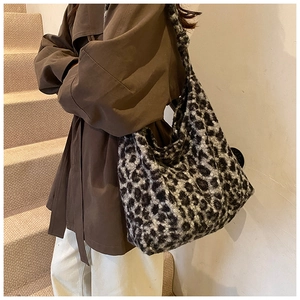 Close-up of leopard print plush tote bag showing fuzzy texture and large capacity