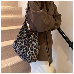 Detail shot of large leopard print hobo bag with fuzzy texture and subtle sequins