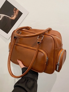 Brown faux leather large tote bag with multi-pocket design for autumn commute and travel