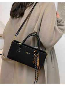 Retro black crossbody handbag for women with gold star charm and braided tassel strap