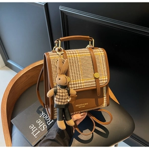 Retro brown leather and plaid crossbody bag with a cute knit rabbit charm accessory