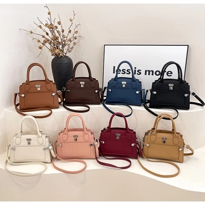 Detailed grid of leather handbags in eight vibrant colors on minimalist display