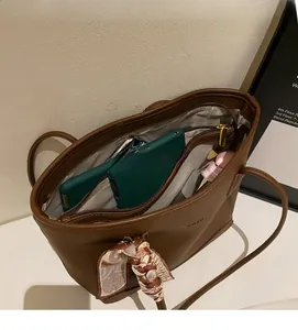Interior view of large leather tote bag with functional pockets and zipper compartments