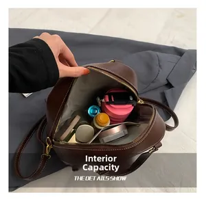 Detail view of the spacious internal capacity for a retro brown leather backpack