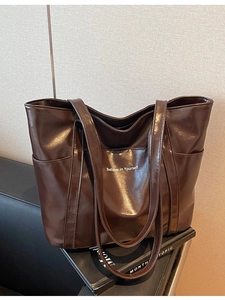 Deep brown glossy PU leather tote bag with Believe in Yourself print and dual straps