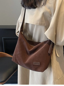 Large vintage brown faux suede shoulder bag with minimalist design and leather tag