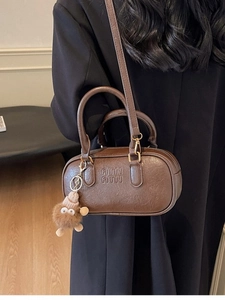 Retro dark brown crossbody pillow bag with lychee texture and plush pendant