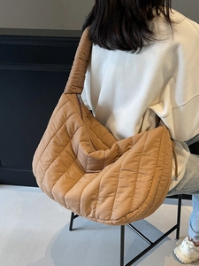Brown quilted puffer hobo bag with large capacity and soft pleated texture design