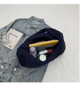 Top view of spacious interior storage in a blue quilted tote bag for daily essentials