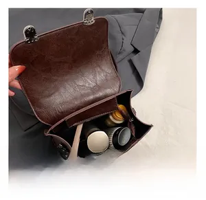 Detail view of brown vintage PU leather bag interior showing large storage capacity