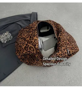 Detailed interior of leopard print quilted tote bag with zipper and large storage space