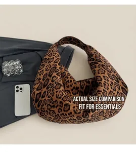 Top view of large leopard print tote bag showing capacity compared to a smartphone