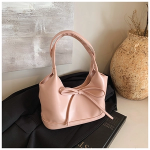Sac à main rose avec nœud décoratif en similicuir et poignées doubles élégantes
