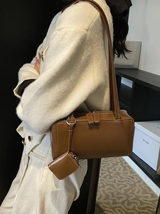 Retro brown minimalist shoulder bag with mini coin purse shown from a side-angle view