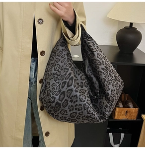Spacious leopard print tote bag styled with a trench coat for a casual autumn look