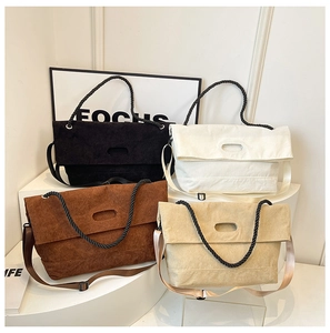 Detail of corduroy tote bags in four colors with rope handles and wide straps