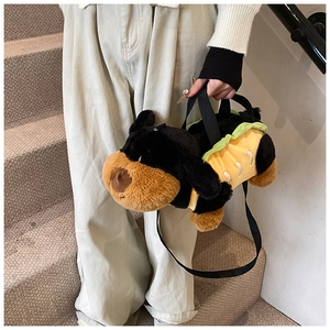Detailed view of dog plush handbag with creative sausage dog hot dog design and strap