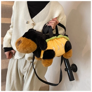 Detail of plush dachshund dog bag with hot dog bun texture and black nylon straps