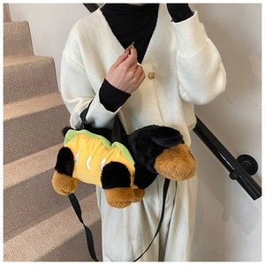 Detail of dachshund hot dog plush bag with nylon straps on model in minimalist setting