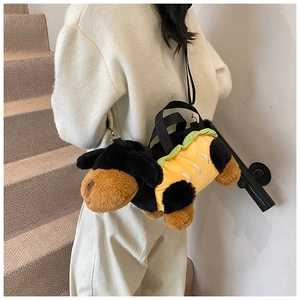 Chic plush dachshund shoulder bag in hot dog style worn by model on stairs
