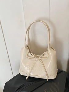 Sac à main élégant blanc crème avec un nœud raffiné et une finition lisse