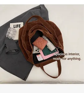 Brown suede tote bag showing large capacity for tablet, umbrella and wallet inside