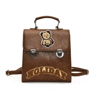 Vintage brown leather backpack with teddy bear embroidery and holiday lettering