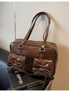 Brown oil wax leather tote bag with bow-knot pockets and white contrast stitching